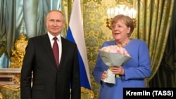 Владимир Путин и Ангела Меркель на встрече в Москве, 21 августа 2021 года