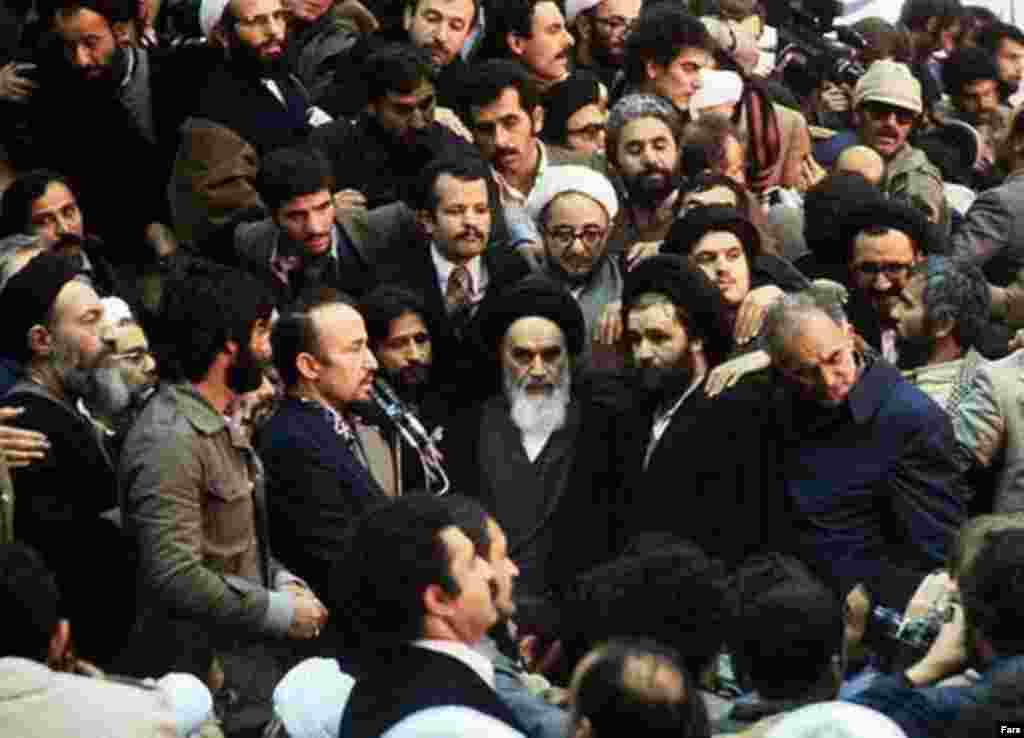 Behind Khomeini (in glasses) is Sadegh Khalkhali, known as "the hanging judge," who was put in charge of the revolutionary courts (Fars) - In the late 1970s, several events brought Khomeini to attention as the center of opposition in Iran. The popular and moderate Islamist Ali Shariati died (allegedly killed by the shah's secret police), removing a potential rival. In October 1979, Khomeini's son, Mustafa, died and was proclaimed a "martyr" by the opposition.