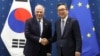 South Korean Foreign Minister Cho Tae-yul (right) shakes hands with European Union foreign policy chief Josep Borrell prior to a meeting at the Foreign Ministry in Seoul on November 4.