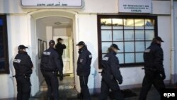 German police stand in front of the Al-Taqwa Mosque during a search in Hamburg on November 15.