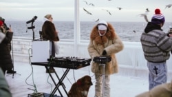 UKRAINE --- Odesa Residents Dance To Warm Up As DJ Plays at Dawn During Alerts