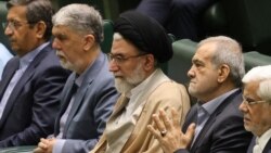 Iranian Intelligence Minister Esmail Khatib (center), pictured in 2024 with President Masud Pezeshkian (center right) was reportedly killed in a strike on March 18.