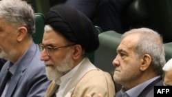 Iranian Minister of Intelligence Esmail Khatib (right) with Iranian President Masud Pezeshkian (file photo)