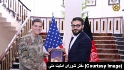 U.S. Central Command head Joseph Votel and Afghanistan security adviser Hamdullah Mohib on February 20