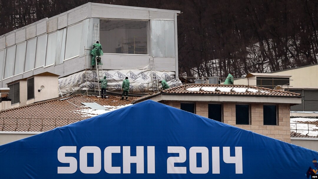 Workers are seen at the construction site of an Olympic venue building in Krasnaya Polyana on January 27.