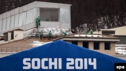 Workers are seen at the construction site of an Olympic venue building in Krasnaya Polyana on January 27.