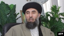 In this file photo taken, 17 October 2001, Gulbuddin Hekmatyar, a former Afghan warlord in exile in Iran, gives an interview to AFP in Tehran. As stated in a report released, 21 November 2004, Warlord Gulbuddin Hekmatyar, who is wanted by Washin