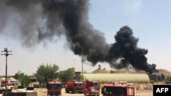 Дым над городом в иракской провинции Киркук