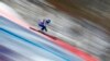Russia&#39;s Aleksandr Glebov takes off in a training session for the men&#39;s alpine skiing downhill race at the Rosa Khutor Alpine Center.