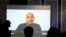 Former Indian Navy officer Kulbhushan Sudhir Jadhav is seen on a screen during a news conference in Pakistan.