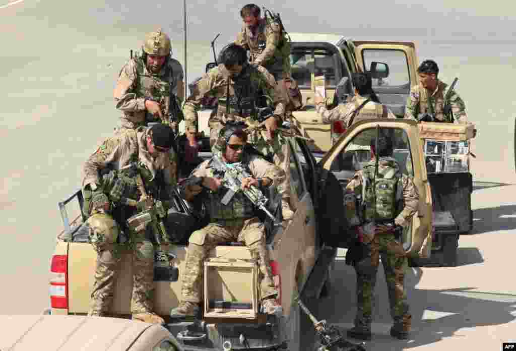 Afghan special forces arrive at the Kunduz airport on September 29 as they prepare to launch a counteroffensive to retake the city from Taliban insurgents.