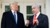 US President Donald Trump and Israeli Prime Minister Benjamin Netanyahu (R) speak to the press on the West Wing Colonnade prior to meetings at the White House in Washington, DC, January 27, 2020. 