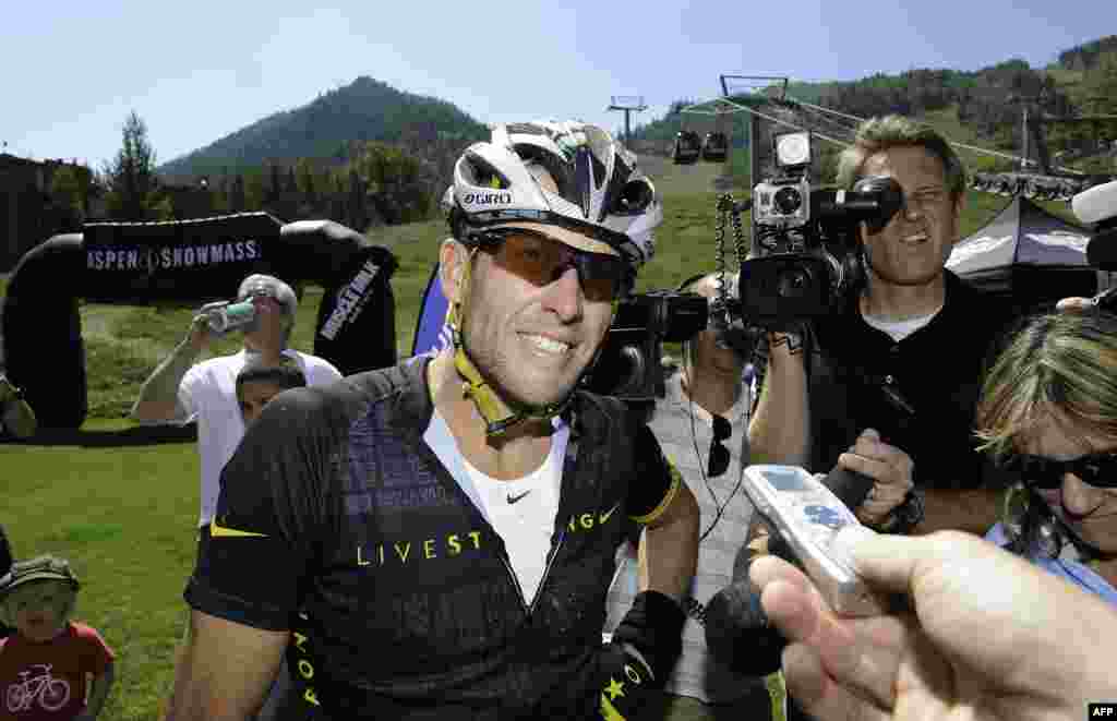 U.S. cyclist Lance Armstrong finishes the Power of Four Mountain Bike Race in Aspen, Colorado, in August. In October, Armstrong was banned for life and stripped of his seven Tour de France titles after the U.S. Anti-Doping Agency declared that he was a "serial cheat who led the most sophisticated, professionalized and successful doping program that sport has ever seen." (AFP/Riccardo Savi)