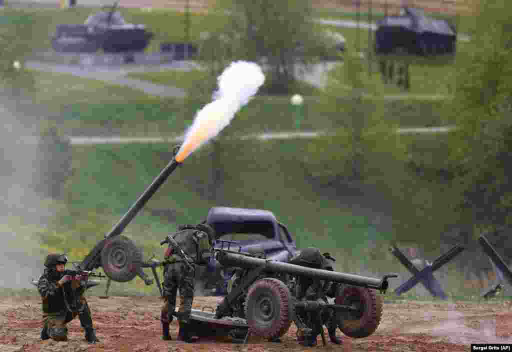 Participants in a Belarusian military show perform near the village of Horoshki on the outskirts of Minsk. (AP/Sergei Grits)