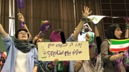 Women holding a sign, saying “After the election can I still come to the stadium?” Many had sent tweets to Rouhani telling him that this should not be the first and last time women are allowed to enter a stadium.