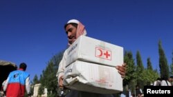 An Afghan man receives aid from the International Federation of the Red Cross and Red Crescent Societies (file photo).