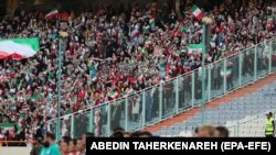 Iranian women cheer during the FIFIA World Cup qualification match between Iran and Cambodia, after FIFA pressured Iran to allow women enter Azadi stadium in Tehran, Iran October 10, 2019.