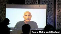 FILE: Former Indian navy officer Kulbhushan Sudhir Jadhav is seen on a screen during a news conference at the Ministry of Foreign Affairs in Islamabad.