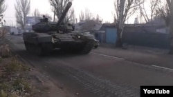 A tank rumbles through the streets on the outskirts of Donetsk on November 8. 