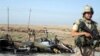 A British soldier secures the site of a suicide car bomb in Al-Basrah on April 20 (file photo)