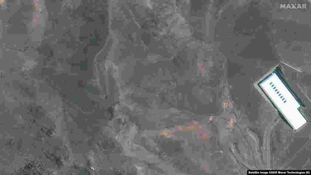 Craters and ash can be seen on a ridge at the Fordow complex in imagery taken after the strikes.
