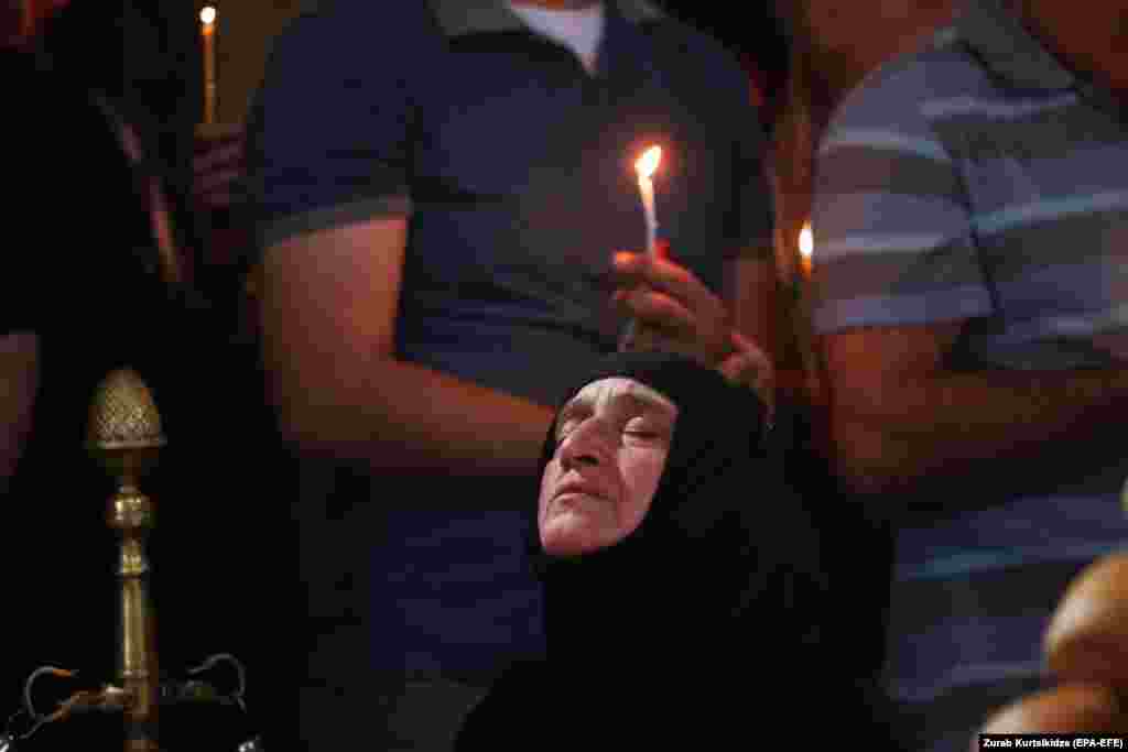 Georgian Orthodox believers attend a service to mark the Day of the Virgin Mary at the Sioni Cathedral in Tbilisi on August 28. (epa-EFE/Zurab Kurtsikidze)