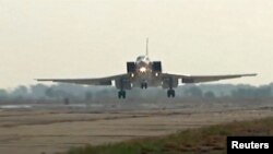 A still image, taken from video footage and released by Russia's Defense Ministry on August 18, 2016, shows a Russian Tupolev Tu-22M3 long-range bomber landing at an air base near the Iranian city of Hamadan.