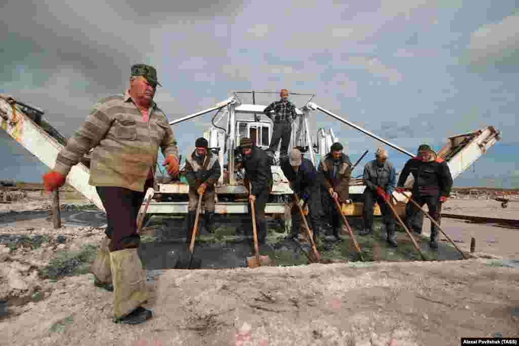 Seasonal workers harvest the salt in autumn, after some of the water in the lagoon has evaporated during the hot summer months.