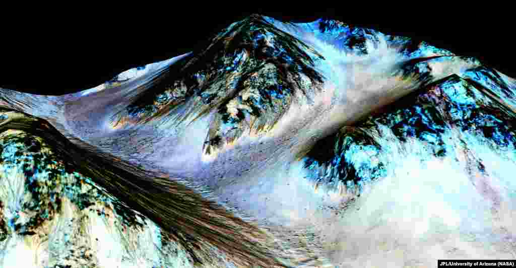 Dark, narrow, 100 meter-long streaks on Mars inferred to have been formed by contemporary flowing water are seen in an image produced by NASA, the Jet Propulsion Laboratory (JPL) and the University of Arizona. Scientists have found the first evidence that briny water may flow on the surface of Mars during the planet's summer months, on September 28, 2015. (NASA)