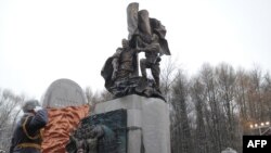 Russian Prime Minister Vladimir Putin takes part in a ceremony in Victory Park on Poklonnaya Hill in Moscow to unveil a replica of the Soviet World War II memorial destroyed in the Georgian city of Kutaisi in December 2009.