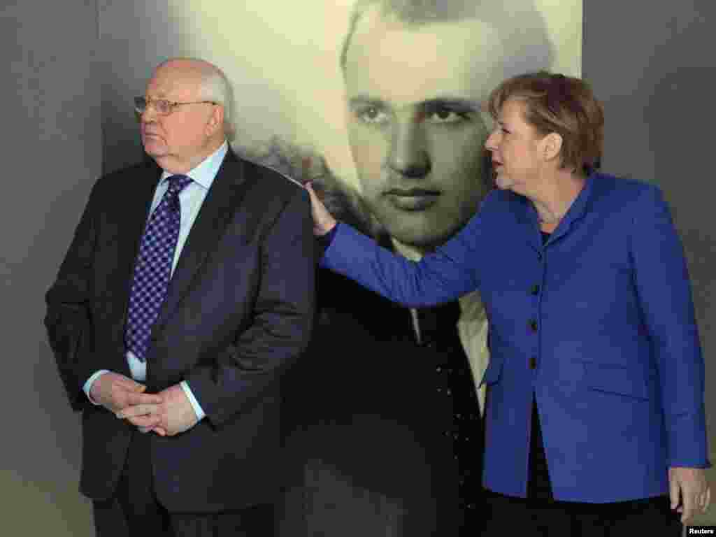 With German Chancellor Angela Merkel at an exhibition marking Gorbachev&#39;s 80th birthday at the Kennedy Museum in Berlin on February 24, 2011.&nbsp;