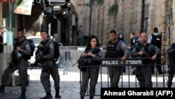 Israeli security forces stand guard at one of the entrances to Al Aqsa mosque compound in the Jerusalem's Old City on July 14, 2017