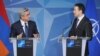 Belgium - NATO Secretary General Anders Fogh Rasmussen (R) and Armenian President Serzh Sarkisian address media after talks in Brussels, 6Mar2012.