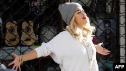 British singer Rita Ora poses during the filming of her new music video in Pristina in September. 