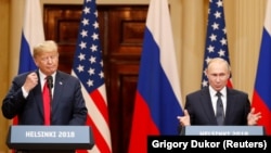 U.S. President Donald Trump (left) and Russian President Vladimir Putin speak to reporters in Helsinki on July 16.