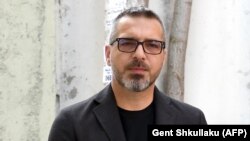 Former Albanian Interior Minister Saimir Tahiri enters a court in Tirana in June.