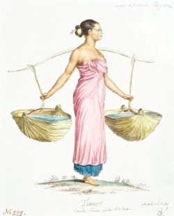 A woman carrying water on the island of Timor.