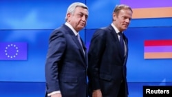 Belgium - Armenia's President Serzh Sargsyan (L) walks next to European Council President Donald Tusk after a joint news statement in Brussels, Belgium February 27, 2017