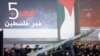 Shiite Muslim supporters of the Hezbollah, gather around a symbolic missile of Fajr 5 (Dawn 5), as they listen to the speech of Hezbollah leader Sheik Hassan Nasrallah during Ashoura Day, in the southern suburb of Beirut, Lebanon, Sunday Nov. 25, 2012.