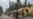 CHINA -- People work on a street in a small village where ethnic Uighurs live on the outskirts of Shayar in the region of Xinjiang, September 13, 2019