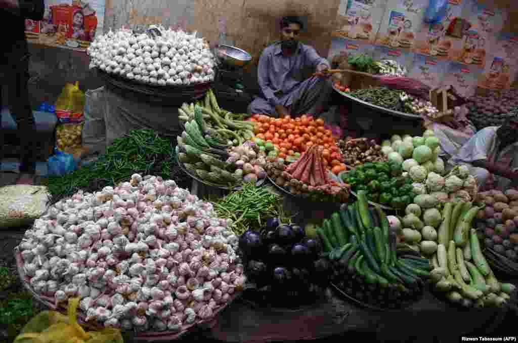 A Pakistani vendor waits for customers at a vegetable roadside shop in Karachi. (AFP/Rizwan Tabassum)