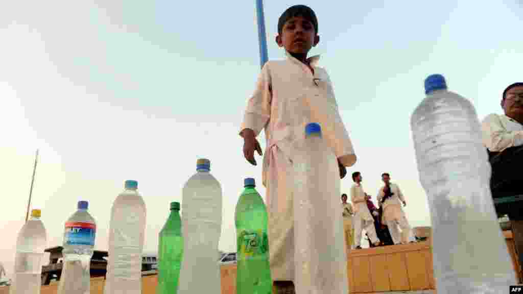 A child sells water on a beach in Karachi, Pakistan.