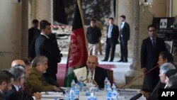 Afghan president Ashraf Ghani (C) speaks during the inauguration of the renovation of the ruined Darul Aman Palace in Kabul on May 30.