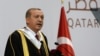 Qatar -- Turkish President Recep Tayyip Erdogan addresses an audience at the Qatar University during a ceremony to award him an honorary doctorate in Doha, December 2, 2015