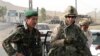 Afghanistan - An Afghan National Army (ANA) soldier (L) and a Canadian soldier with the NATO-led International Security Assistance Force (ISAF) at a checkpoint of Arghandab district in Kandahar, 17Jun2008