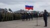 Participants attend a ceremony to welcome Russian military jets and pilots upon their return to a domestic airbase on March 15, not long after President Vladimir Putin announced that they had "generally accomplished" their objectives in Syria.