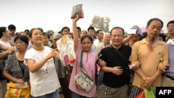 Supporters wait outside the trial of Chinese human rights activist Wang Lihong in Beijing in August.