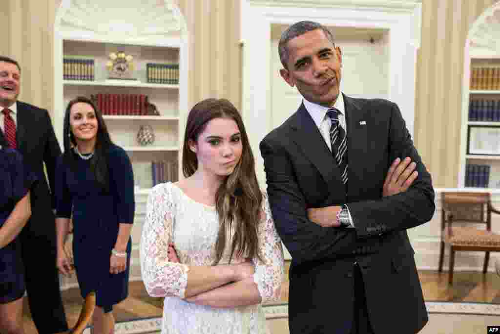 U.S. President Barack Obama jokingly mimicks the "not impressed" look of U.S. Olympic gymnast McKayla Maroney (left) while greeting members of the 2012 U.S. Olympic gymnastics teams in the Oval Office. (AFP/White House Photo/Pete Souza)