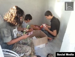 The "religious toothbrushes" were wrapped in colorful propaganda pamphlets and given to people in cars and on motorbikes passing through Nusra checkpoints in northern Aleppo.