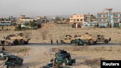 Afghan security forces take their positions in Kunduz city on September 29.